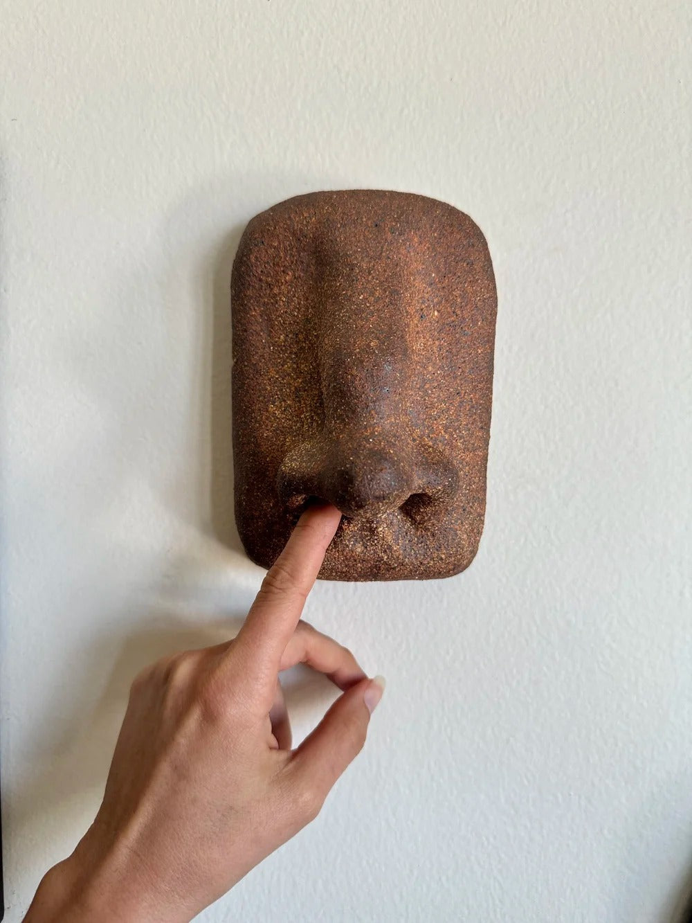 A Hanging Nose Sculpture by Le Minou Studio