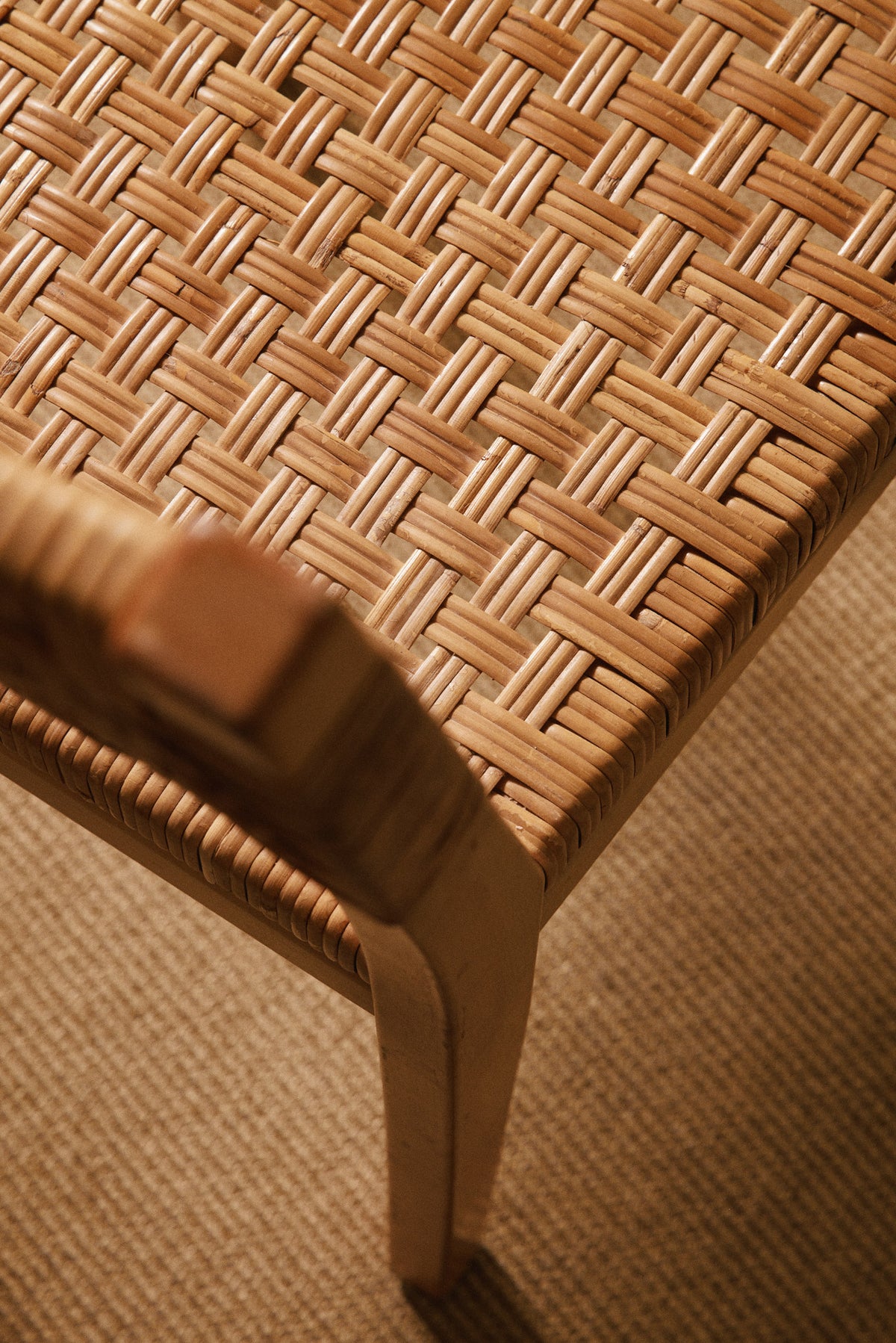 Aino Aalto birch and woven rattan 615 chairs, close view of the woven seat and front leg