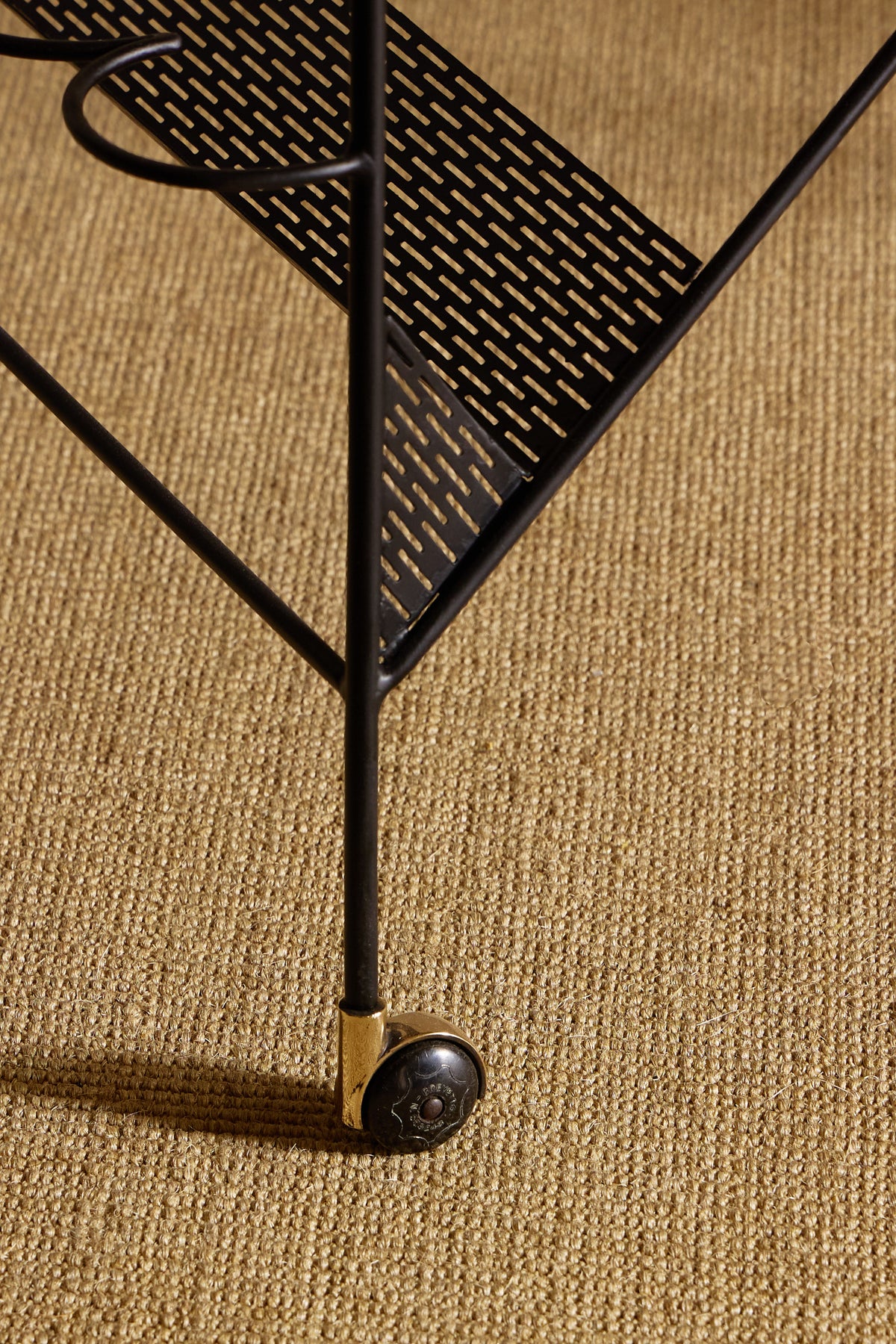 Jacques Adnet lacquered metal and leather night valet, close view of the perforated metal shelf and foot