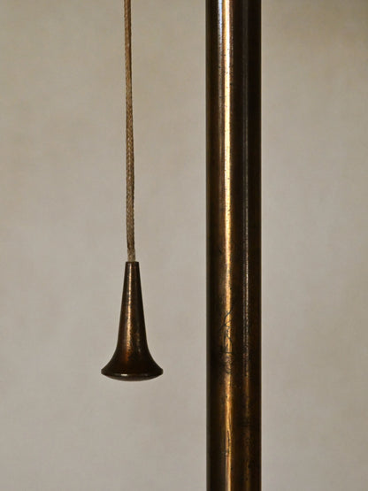 brass and fabric "Trottola" floor lamp, detail of the brass pull and stem