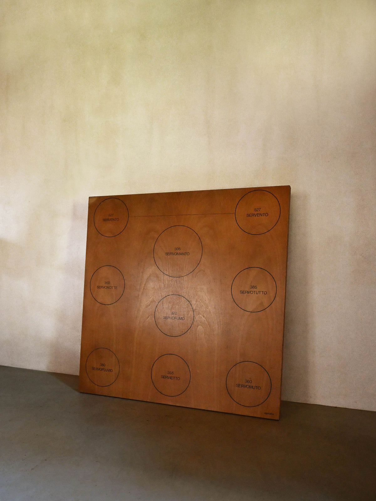 Achille Castiglioni low table for Zanotta, stood upright, showing the marked circles across the top