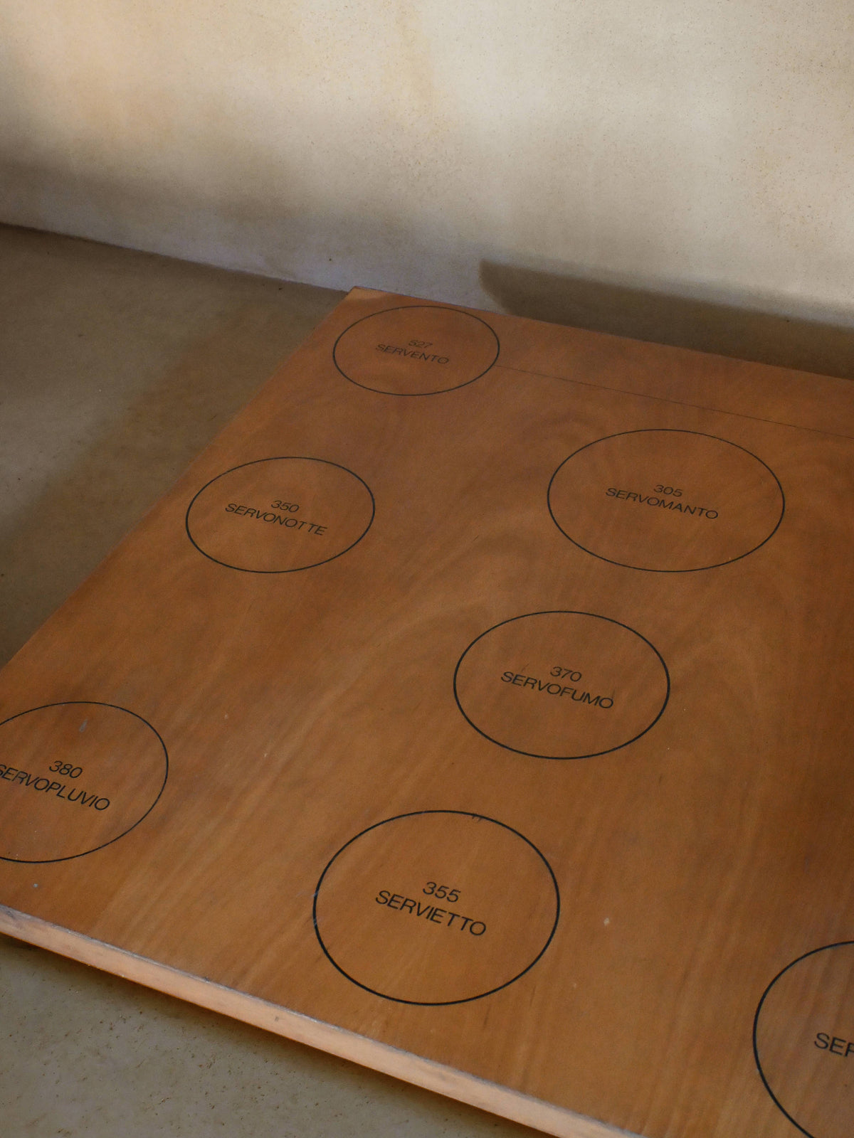 Achille Castiglioni low table for Zanotta, top surface seen at an angle, marked positions visible