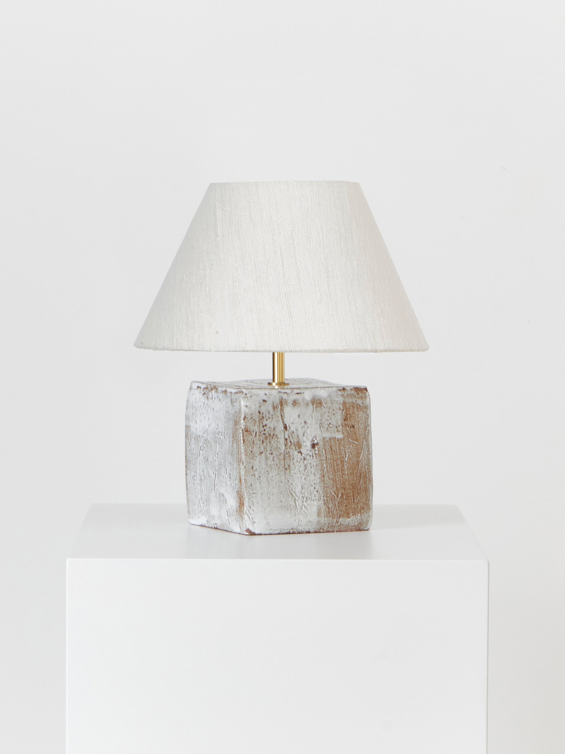 Arouca Table Light in White on Textured Brown Clay Table Lamps