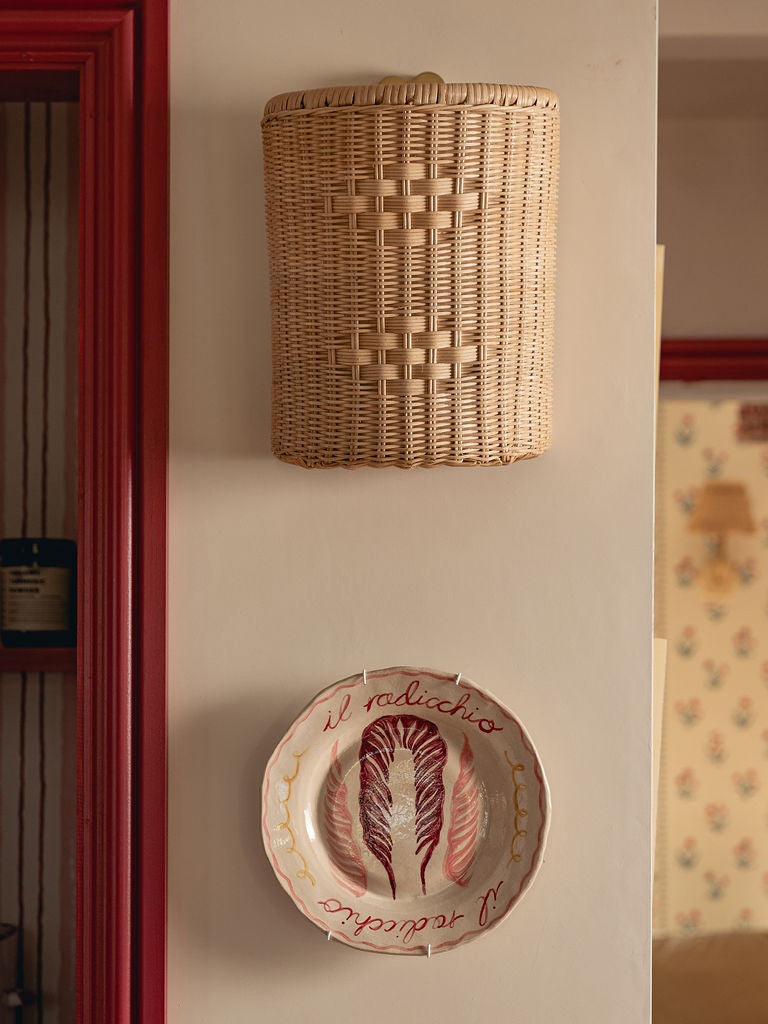 Beatrice Wall Light Shade, Natural, mounted in a hallway above a decorative plate