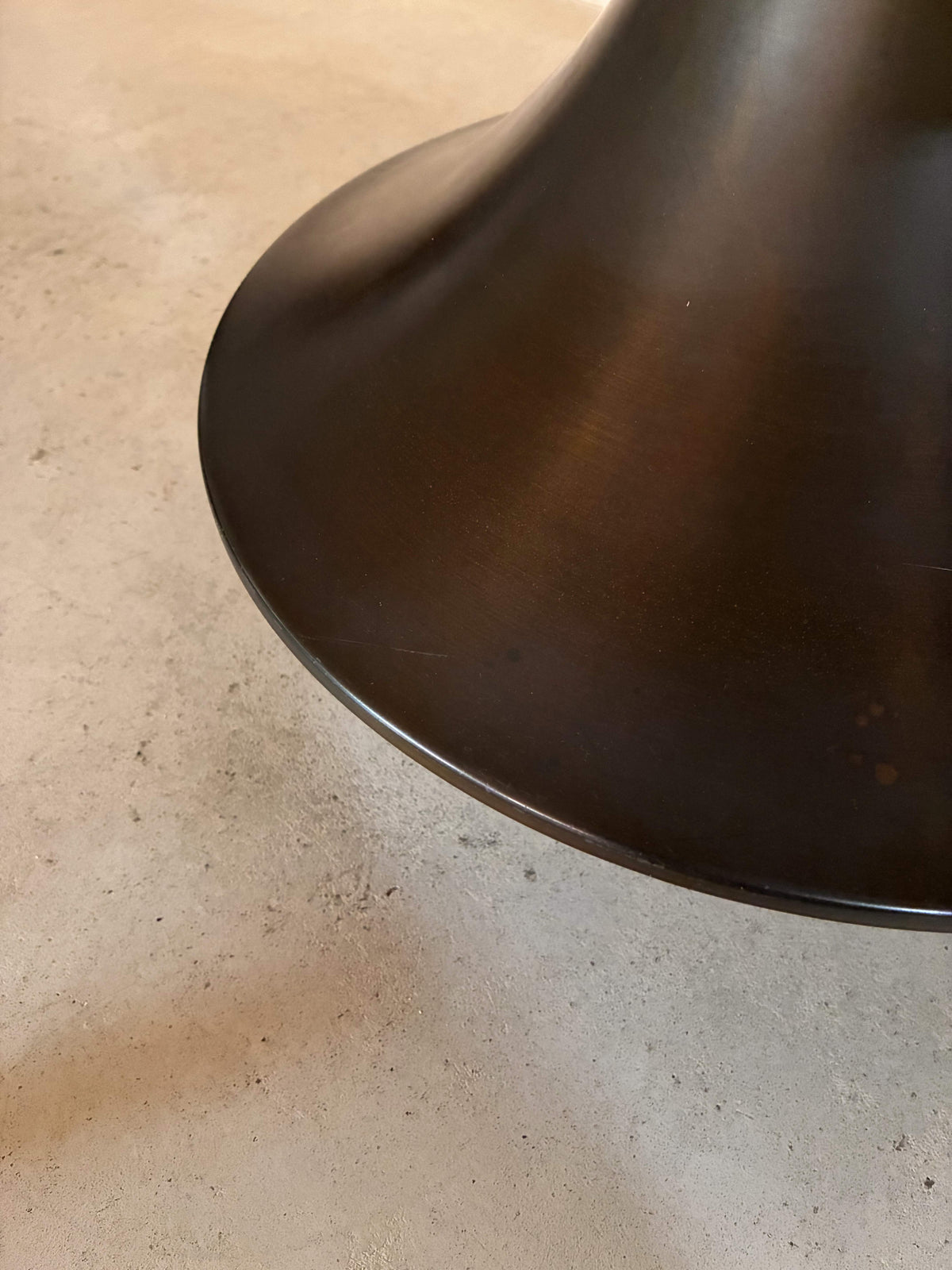 bronze lamp with parchment shade, close detail of the bronze surface and patina