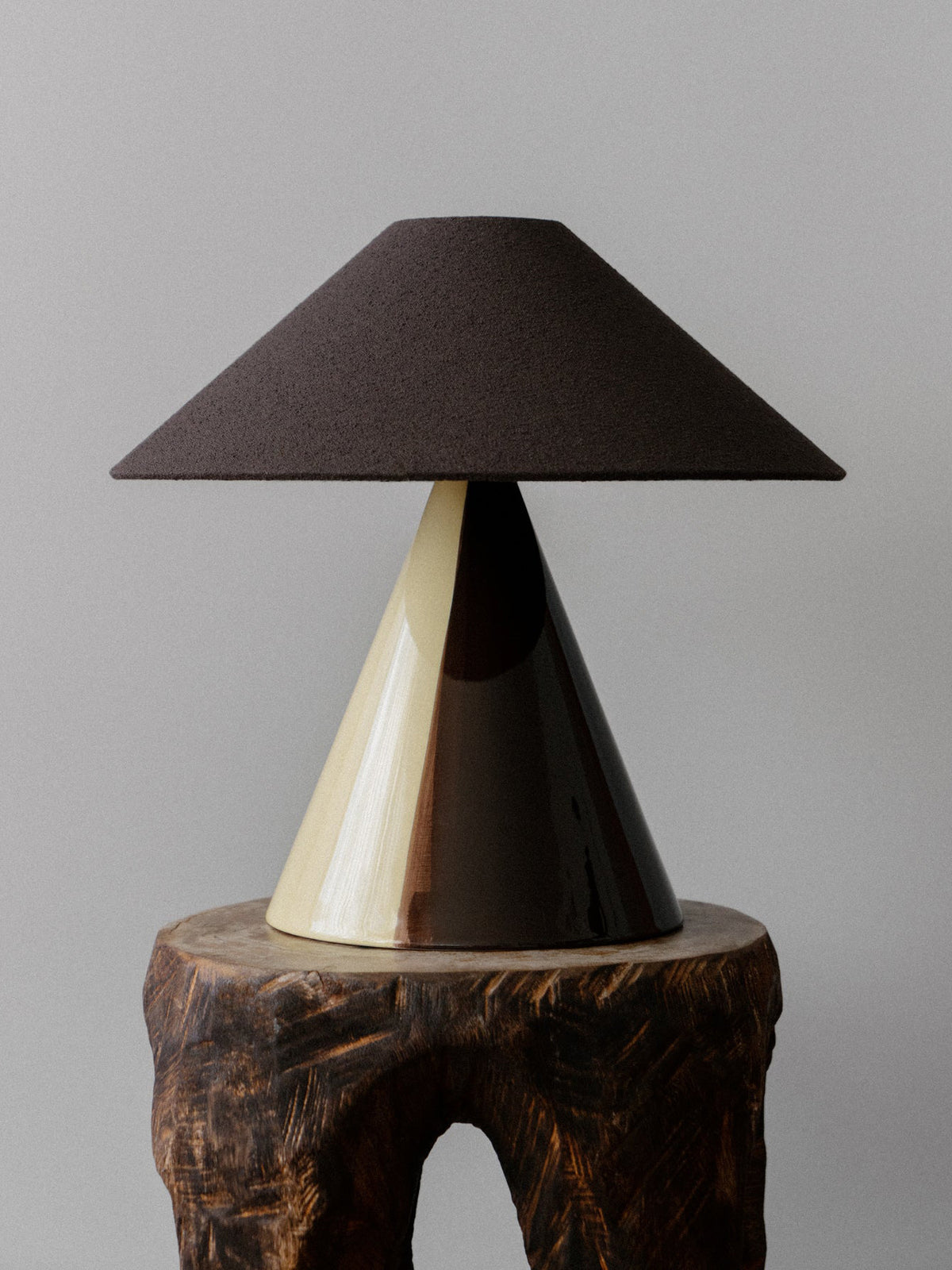 Caterina Table Lamp in Butter Ristretto, on a carved wooden stool