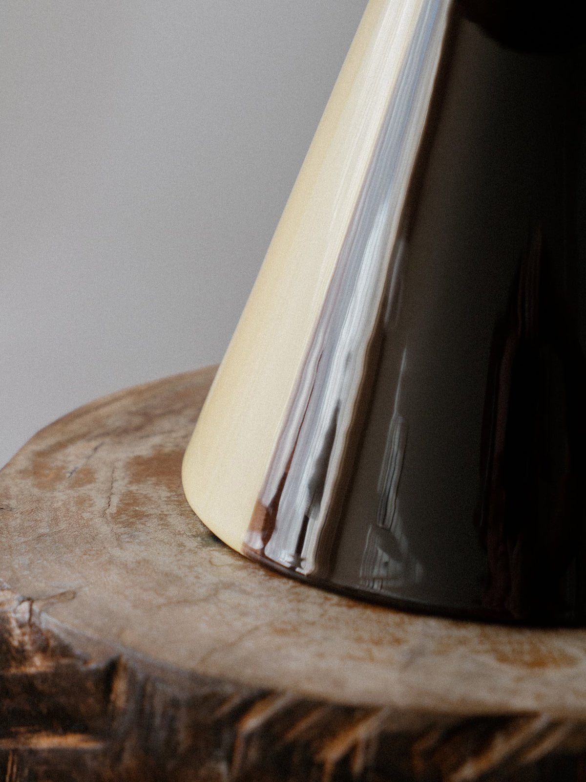 Caterina Table Lamp in Butter Ristretto, close up of the glazed cone base