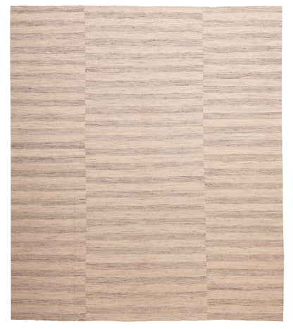 Flat-weave Rug in Sand, overhead view of the full sand and ivory wool rug