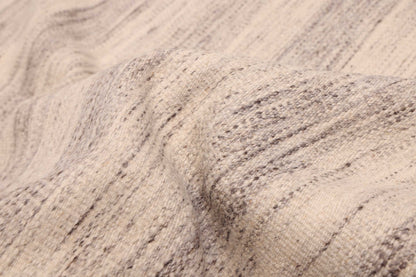 Flat-weave Rug in Sand, folded to show the flat weave