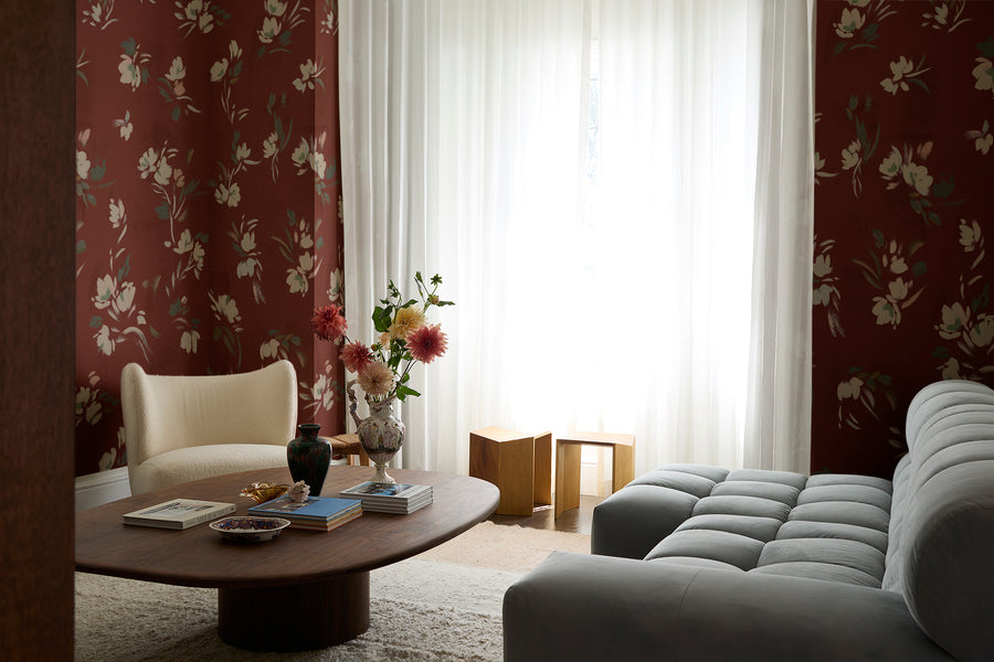 Floating Slowly Wallpaper in Red Dahlia by Papier, installed in a living room