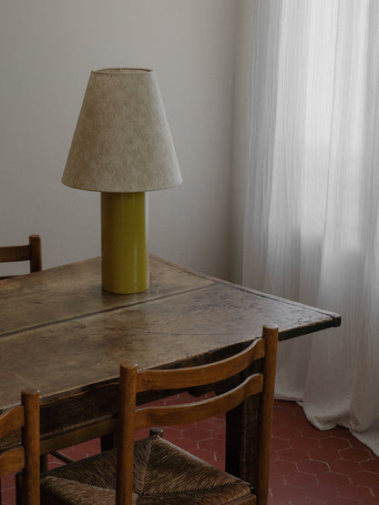Giro Table Lamp in Chartreuse Florale, on a dining table by a window