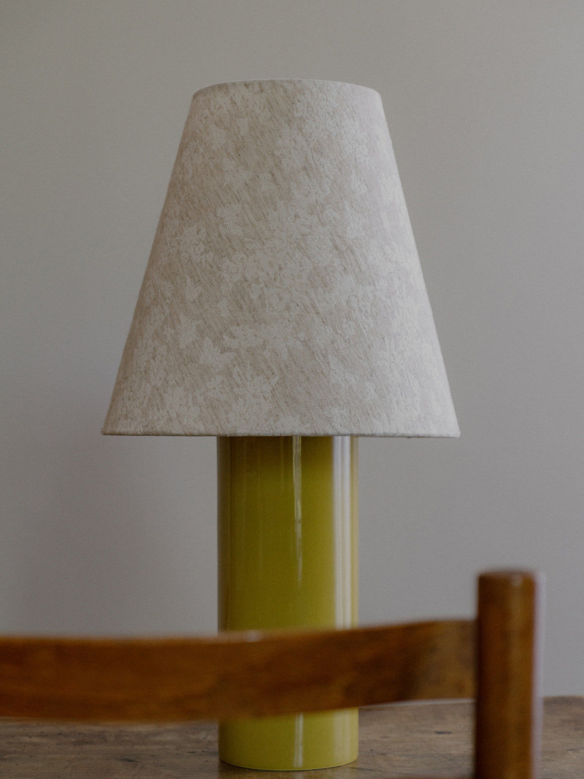 Giro Table Lamp in Chartreuse Florale, close up of the floral jacquard shade and chartreuse base