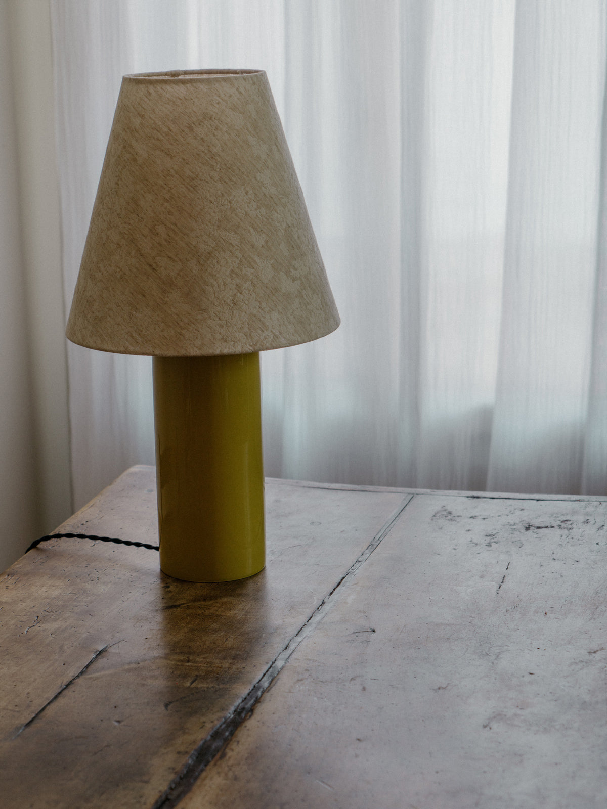 Giro Table Lamp in Chartreuse Florale, on a wooden table, side view