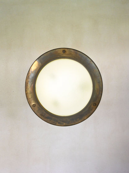 Luigi Caccia Dominioni LSP6 wall light for Azucena, giant version, lit, the glass dome glowing within the brass ring