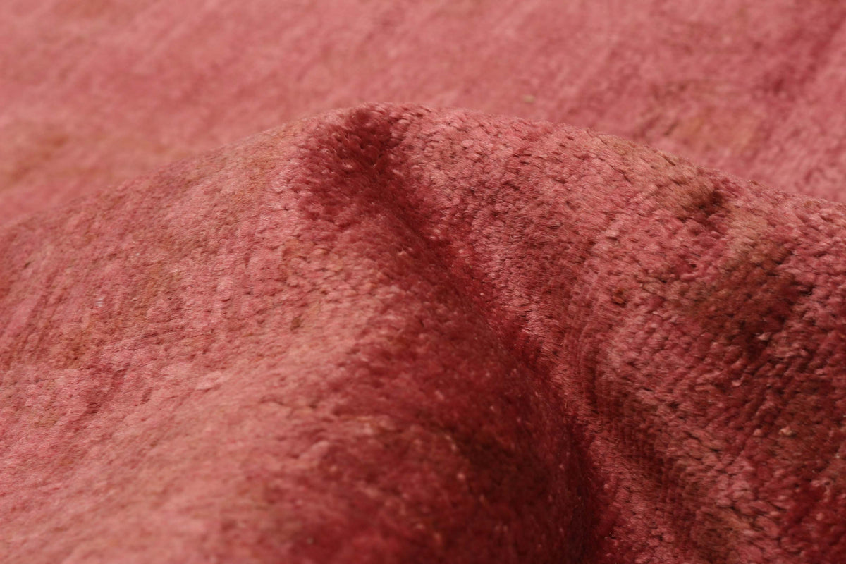 Overdyed Rug in Cranberry, folded to show the wool pile