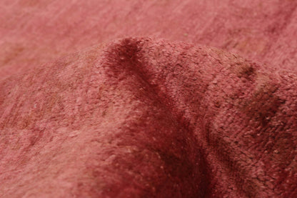 Overdyed Rug in Cranberry, folded to show the wool pile