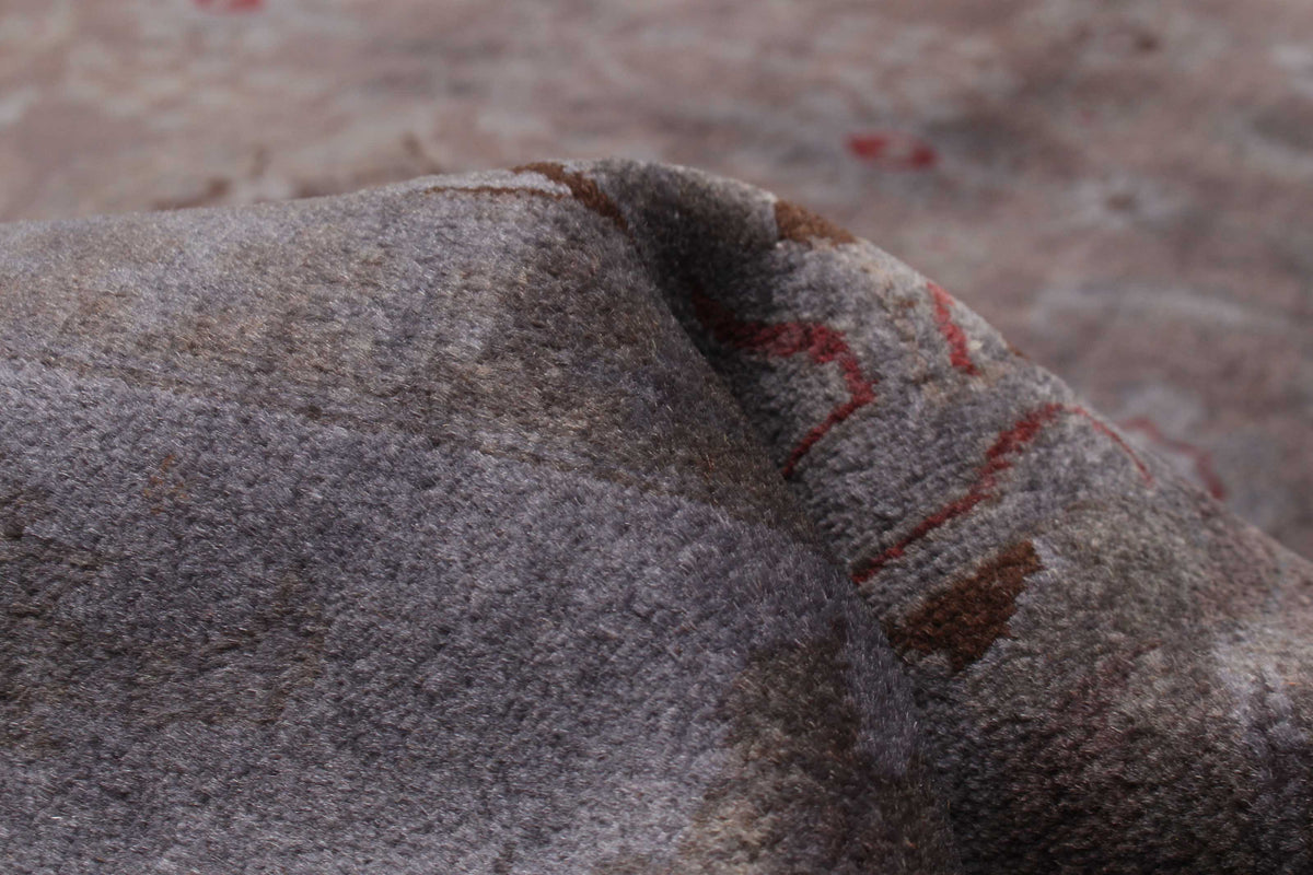 Overdyed Rug in Plum, folded to show the wool pile