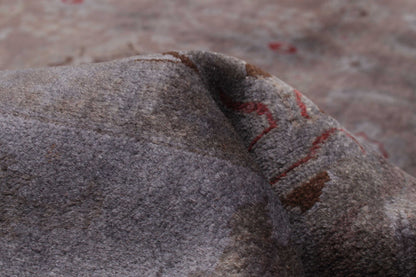 Overdyed Rug in Plum, folded to show the wool pile