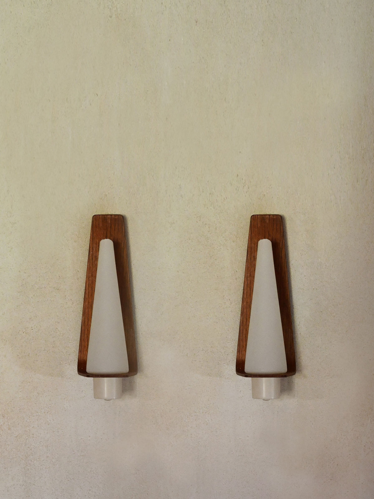 "Pinetti" wood and frosted glass sconce, the pair mounted without their glass shades