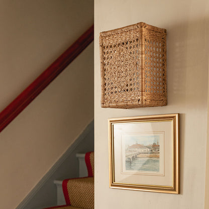 Retro Wall Light Shade, Natural, mounted beside a staircase above a framed print