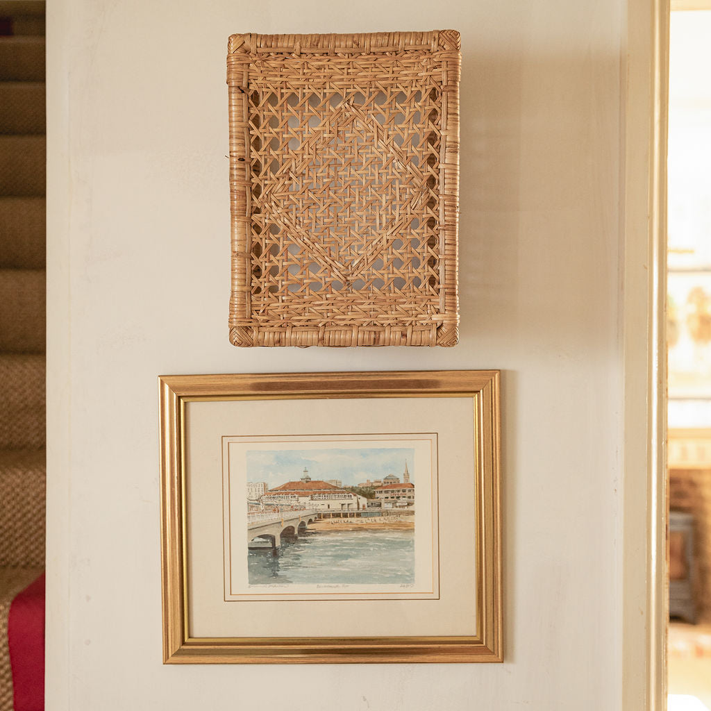 Retro Wall Light Shade, Natural, front view on a wall above a framed print