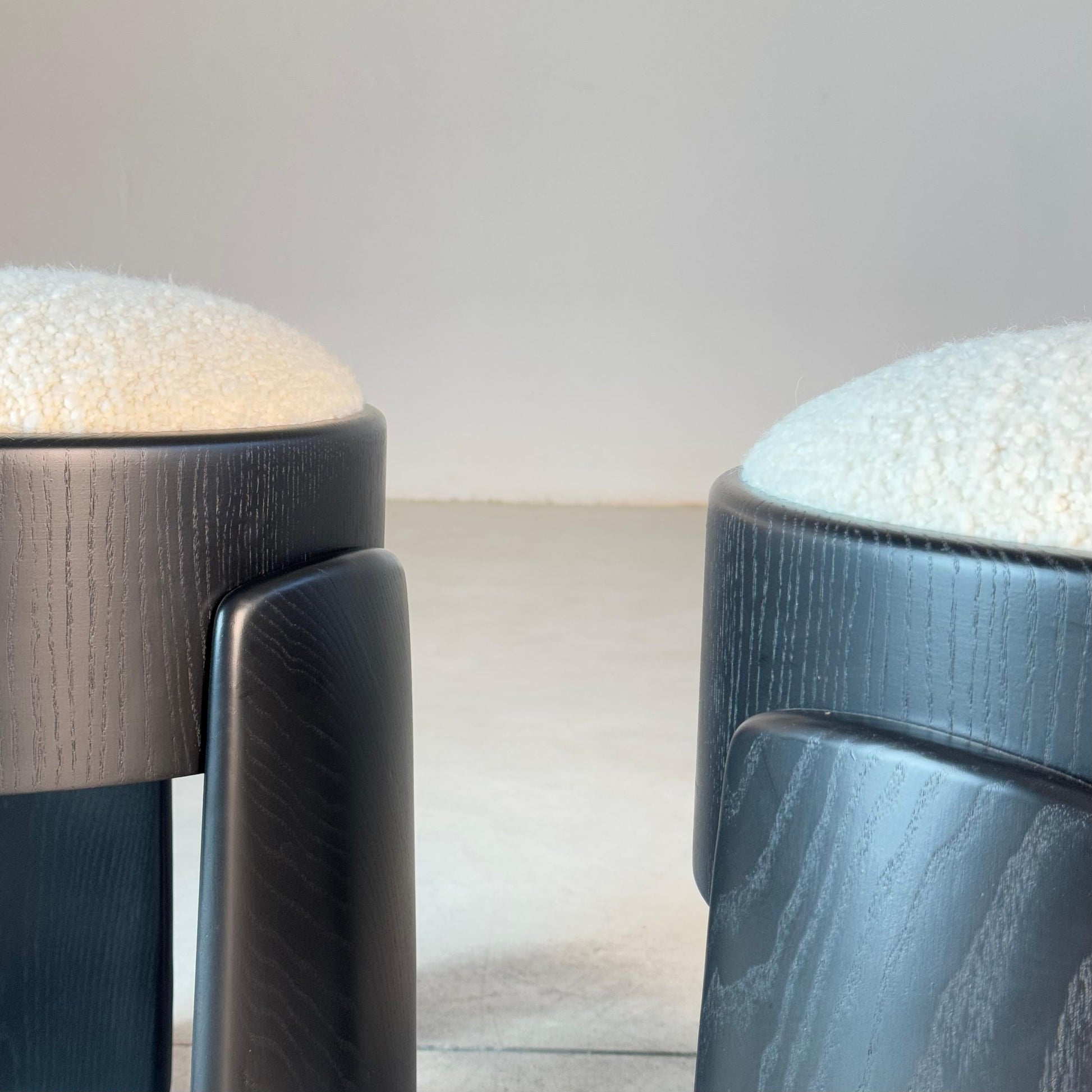 Sculptural Pair of Black Ash Wood Stools with Dedar Milano Boucle Ivory by FORME Stools