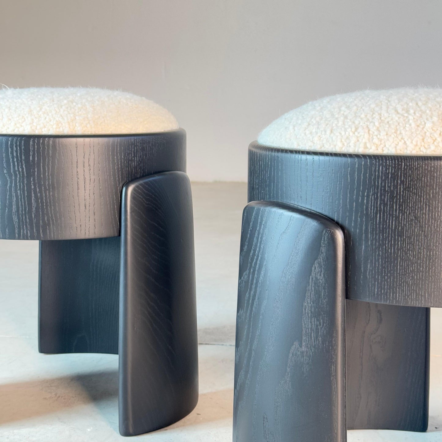 Sculptural Pair of Black Ash Wood Stools with Dedar Milano Boucle Ivory by FORME Stools