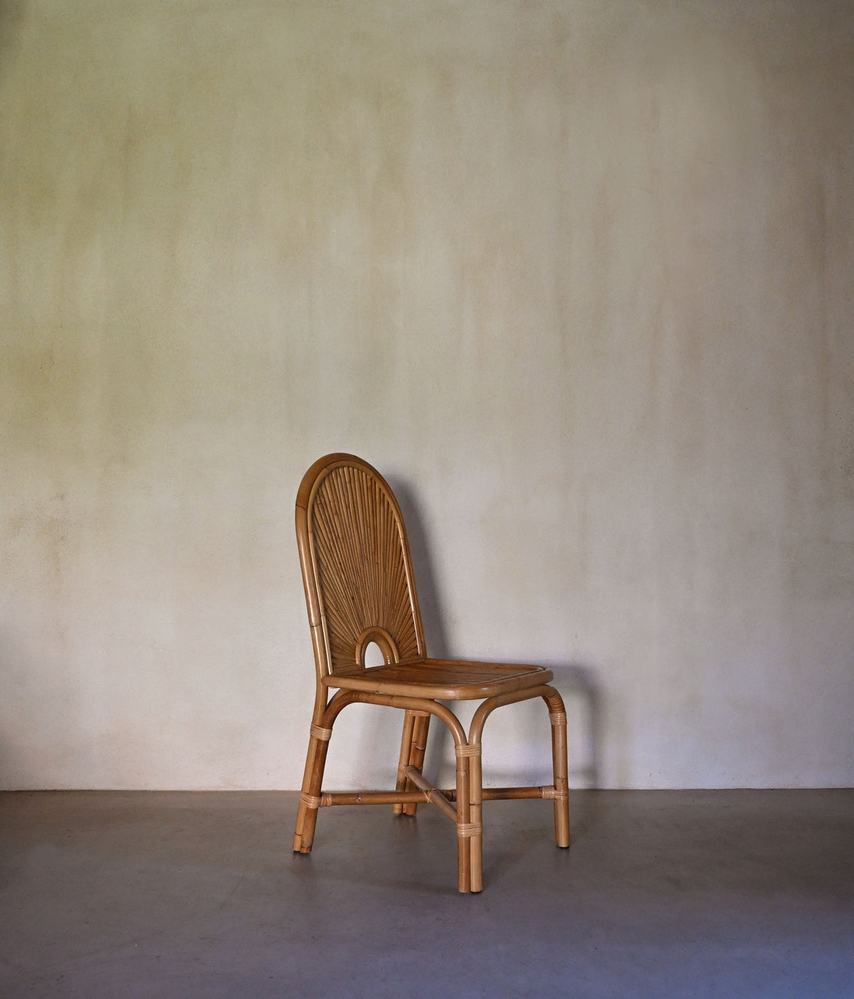 woven rattan chair, a single chair, three-quarter view