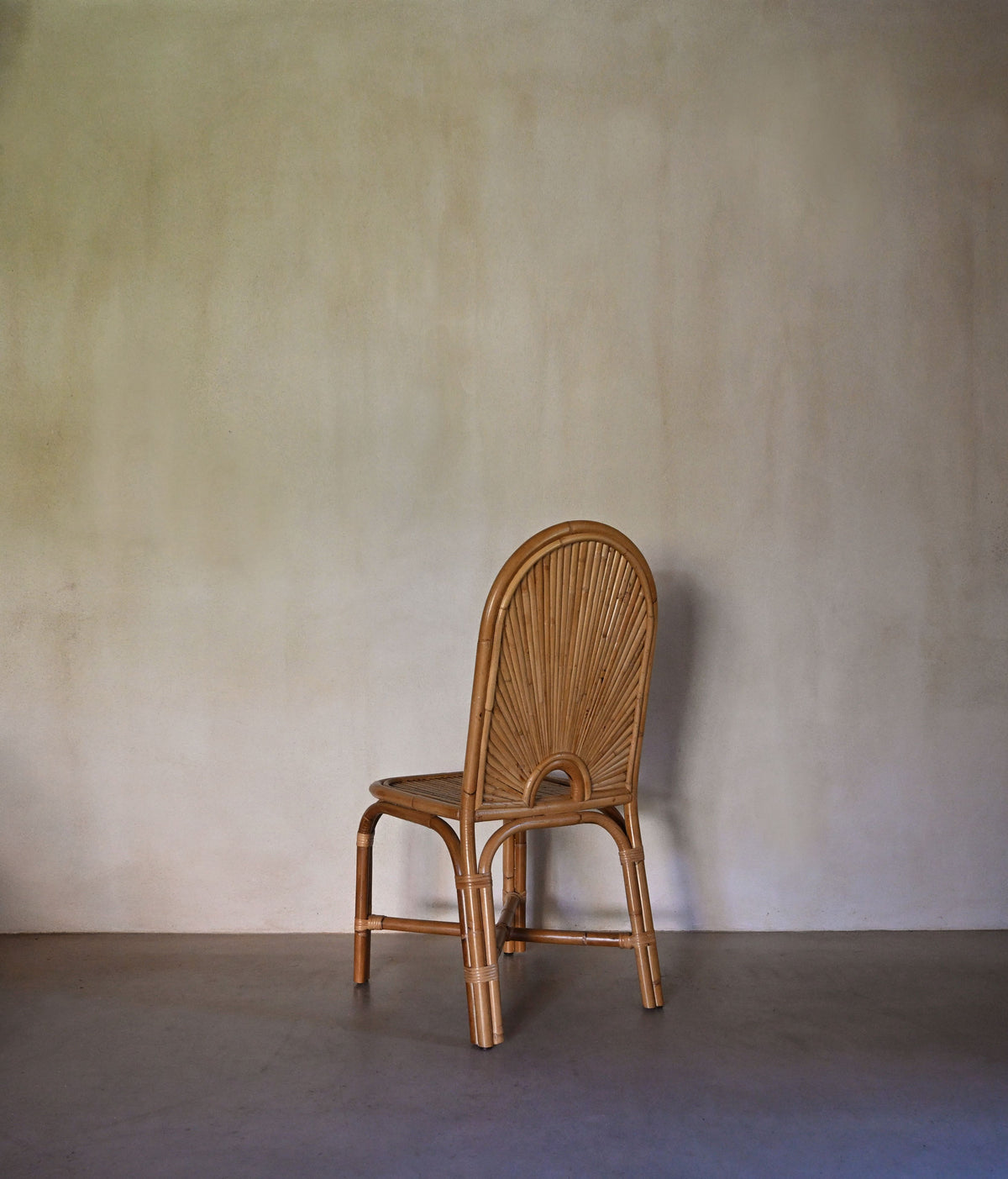 woven rattan chair, a single chair seen from the front