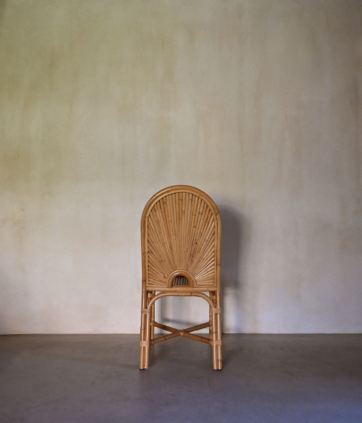 woven rattan chair, a single chair seen from behind
