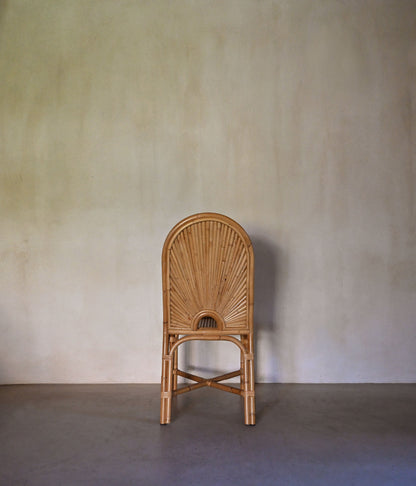 woven rattan chair, a single chair seen from behind
