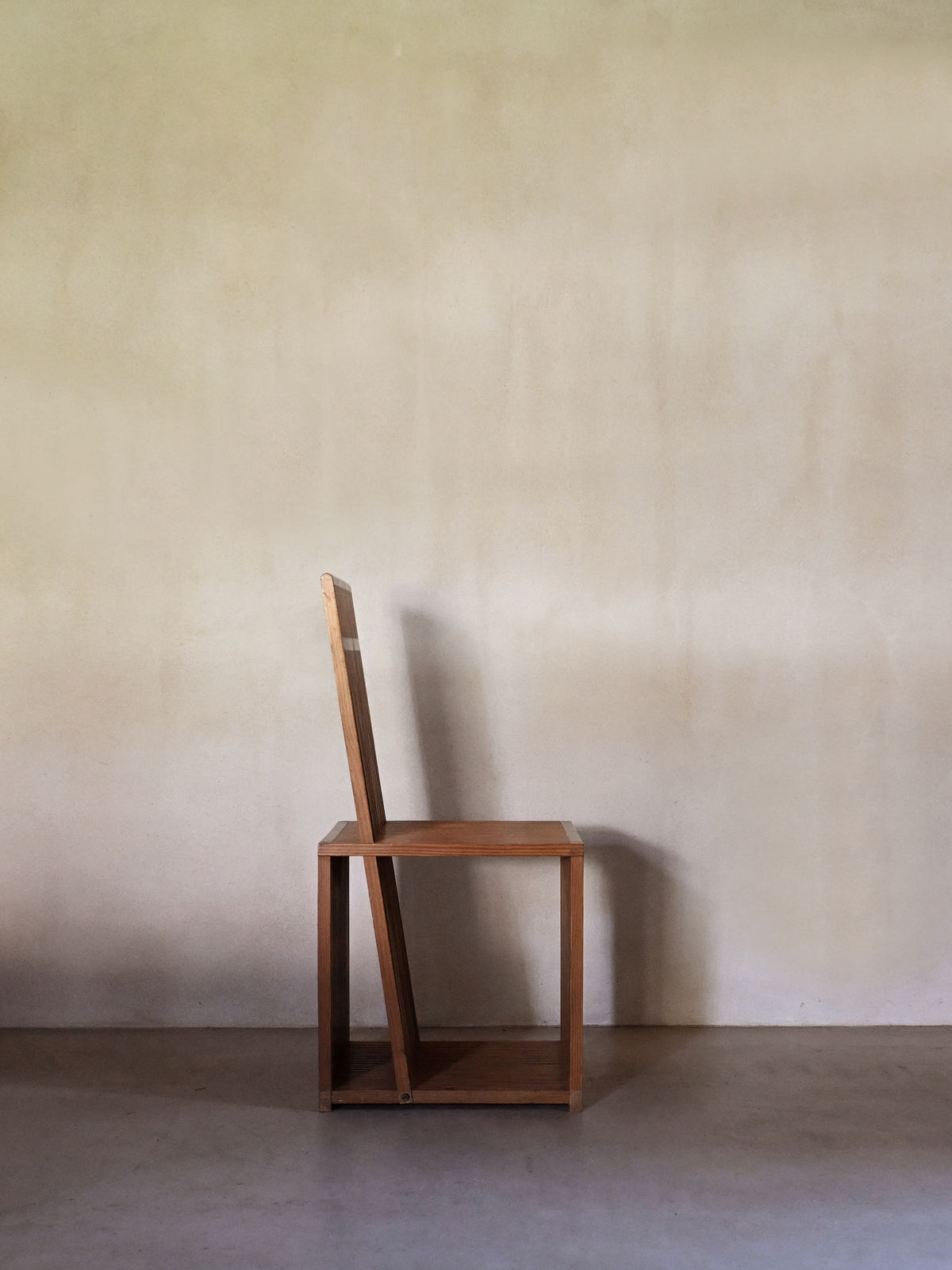 Brutalist wood Strips occasional chair, front view with the tall backrest