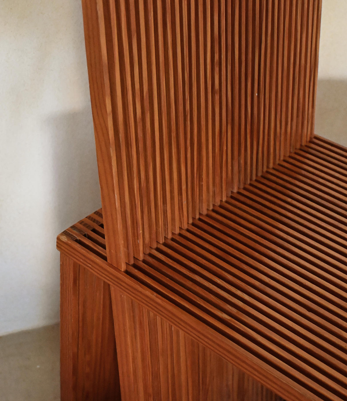Brutalist wood Strips occasional chair, detail of the junction between seat and back