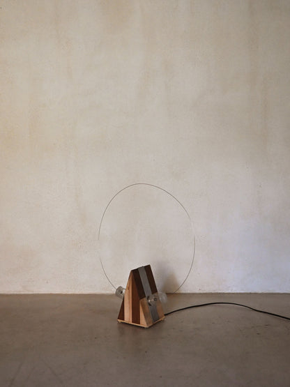 Studio A.R.D.I.T.I. "BT1972" lamp, unlit, seen from a lower angle with the wire hoop behind