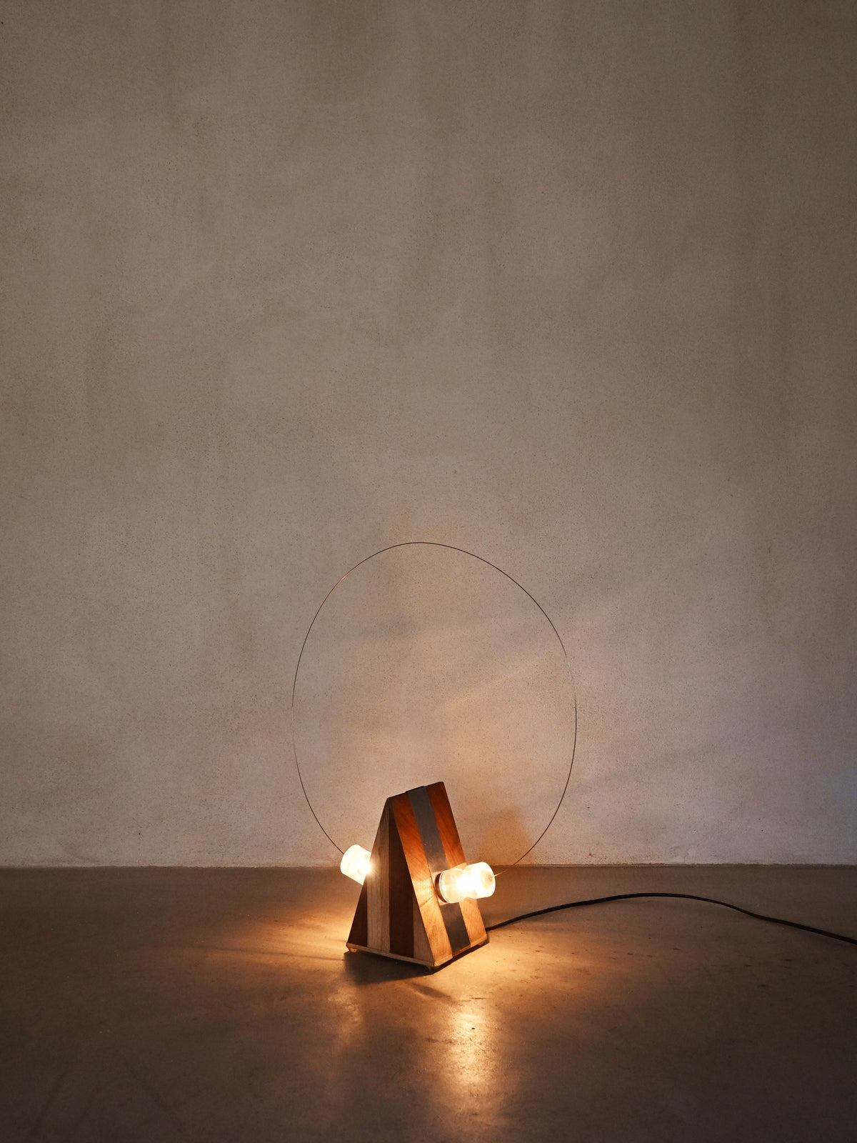 Studio A.R.D.I.T.I. "BT1972" lamp, lit, seen from a lower angle