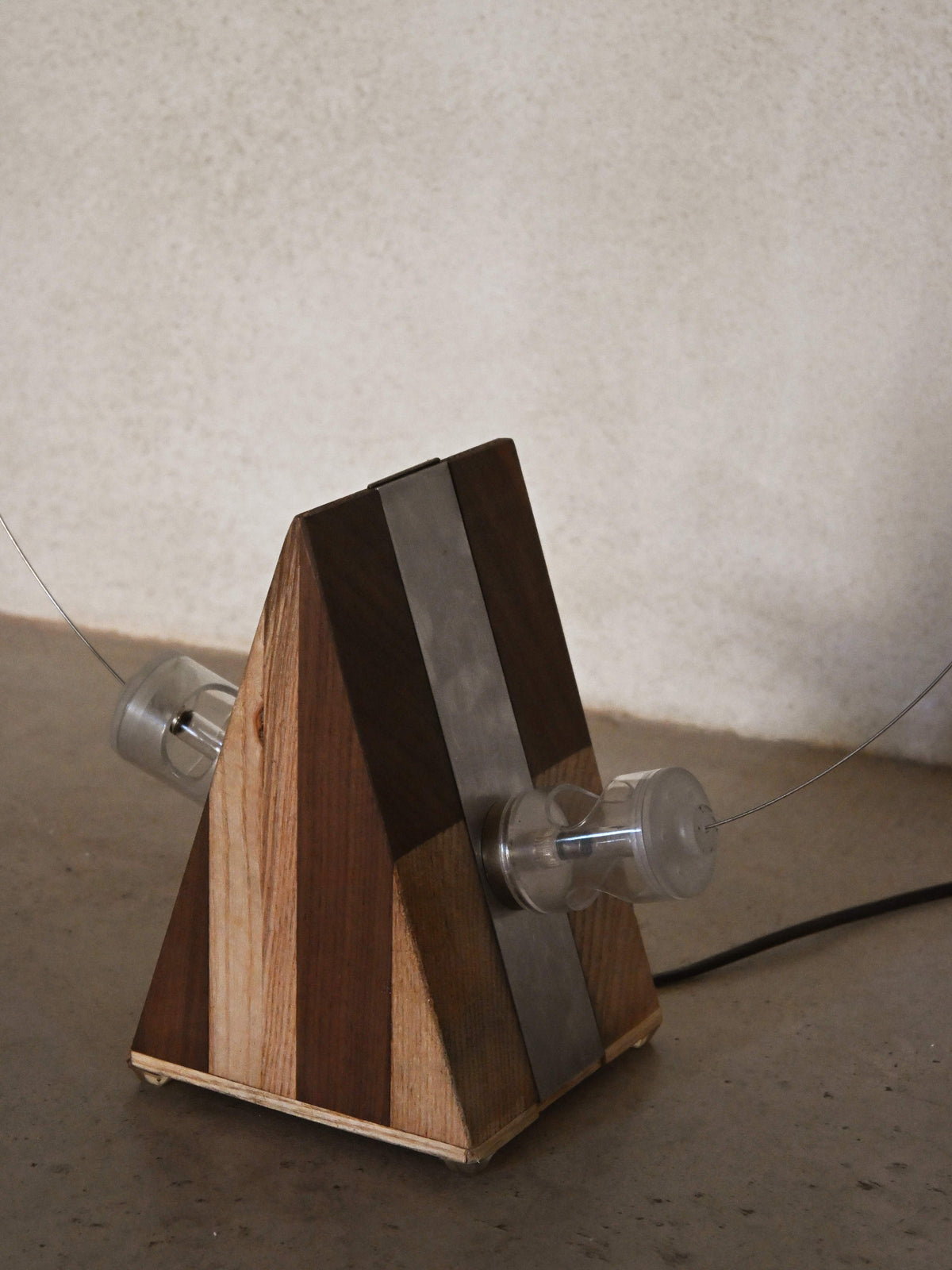 Studio A.R.D.I.T.I. "BT1972" lamp, close view of the inlaid wood body and magnetic bulb holder