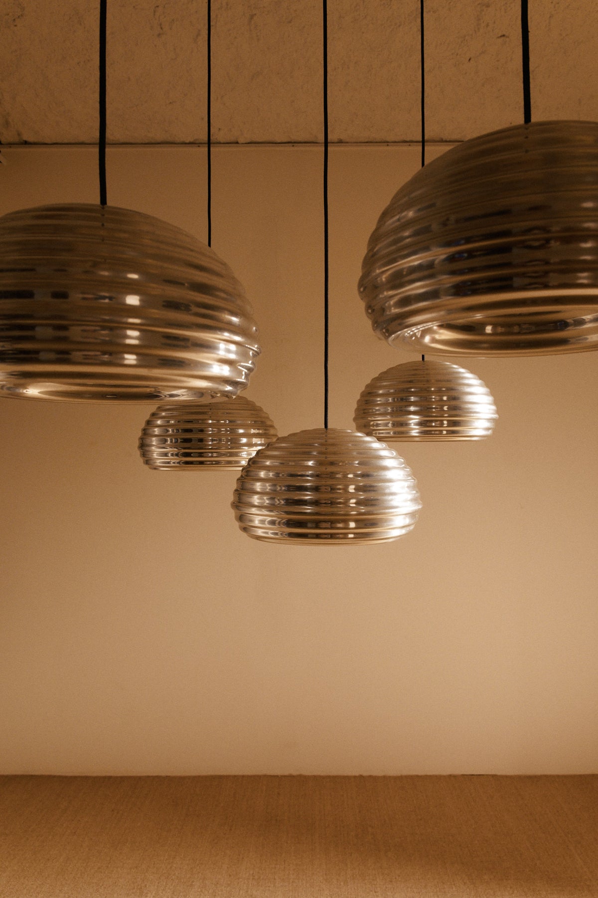 Achille Castiglioni Splugen Brau pendant lights, wide view of the five pendants