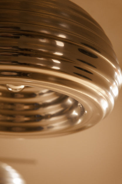 Achille Castiglioni Splugen Brau pendant lights, close view of the ribbed aluminum shade