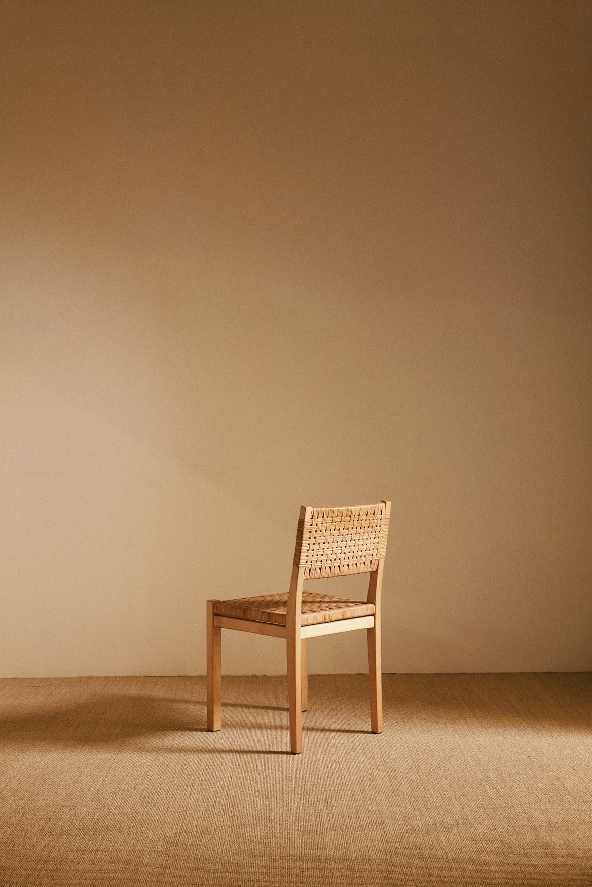 Aino Aalto birch and woven rattan 615 chairs, single chair, angled front view
