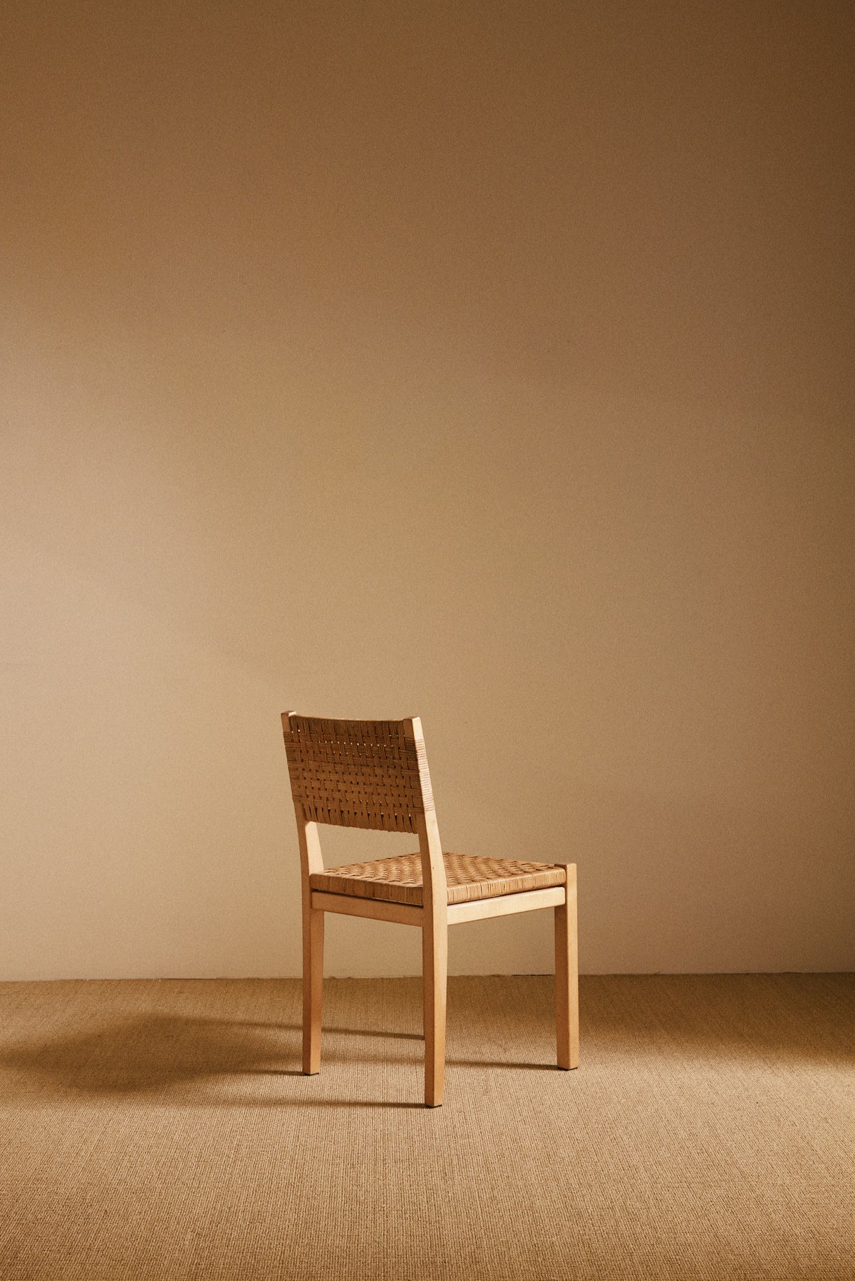 Aino Aalto birch and woven rattan 615 chairs, single chair, angled rear view