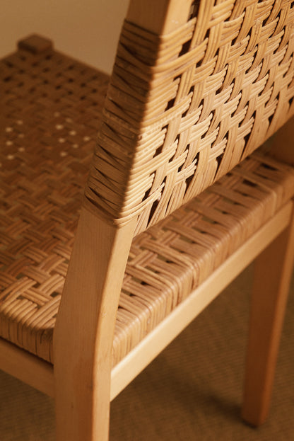 Aino Aalto birch and woven rattan 615 chairs, close view of the woven back and seat