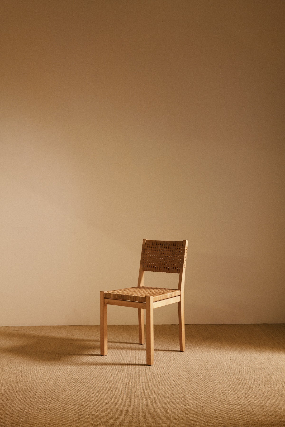 Aino Aalto birch and woven rattan 615 chairs, single chair, low front view