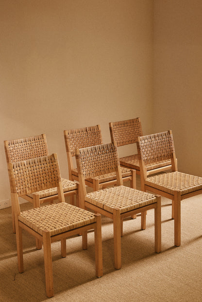 Aino Aalto birch and woven rattan 615 chairs, set of six seen together