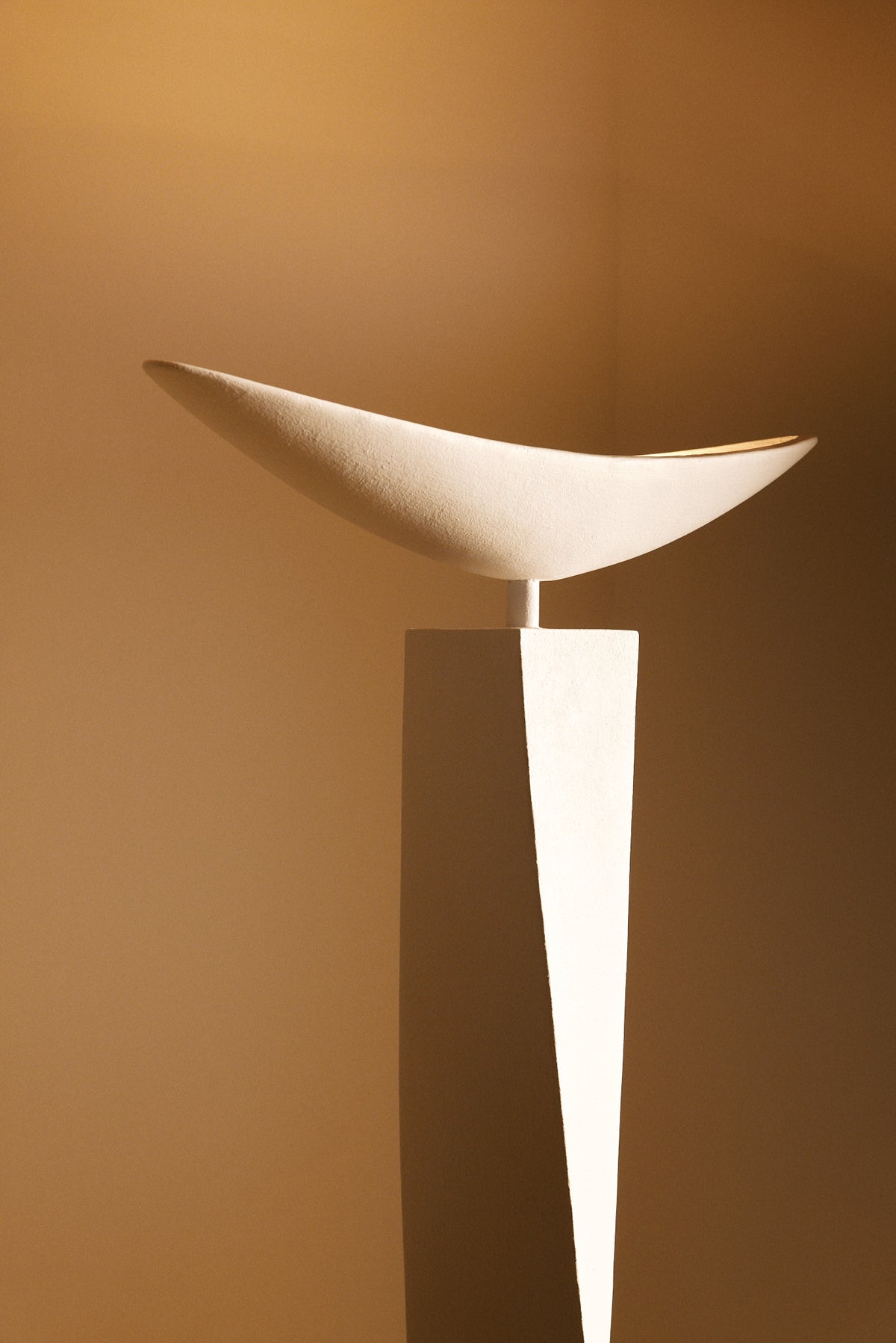 Alexander plaster floor lamp, angled view of the shallow dish