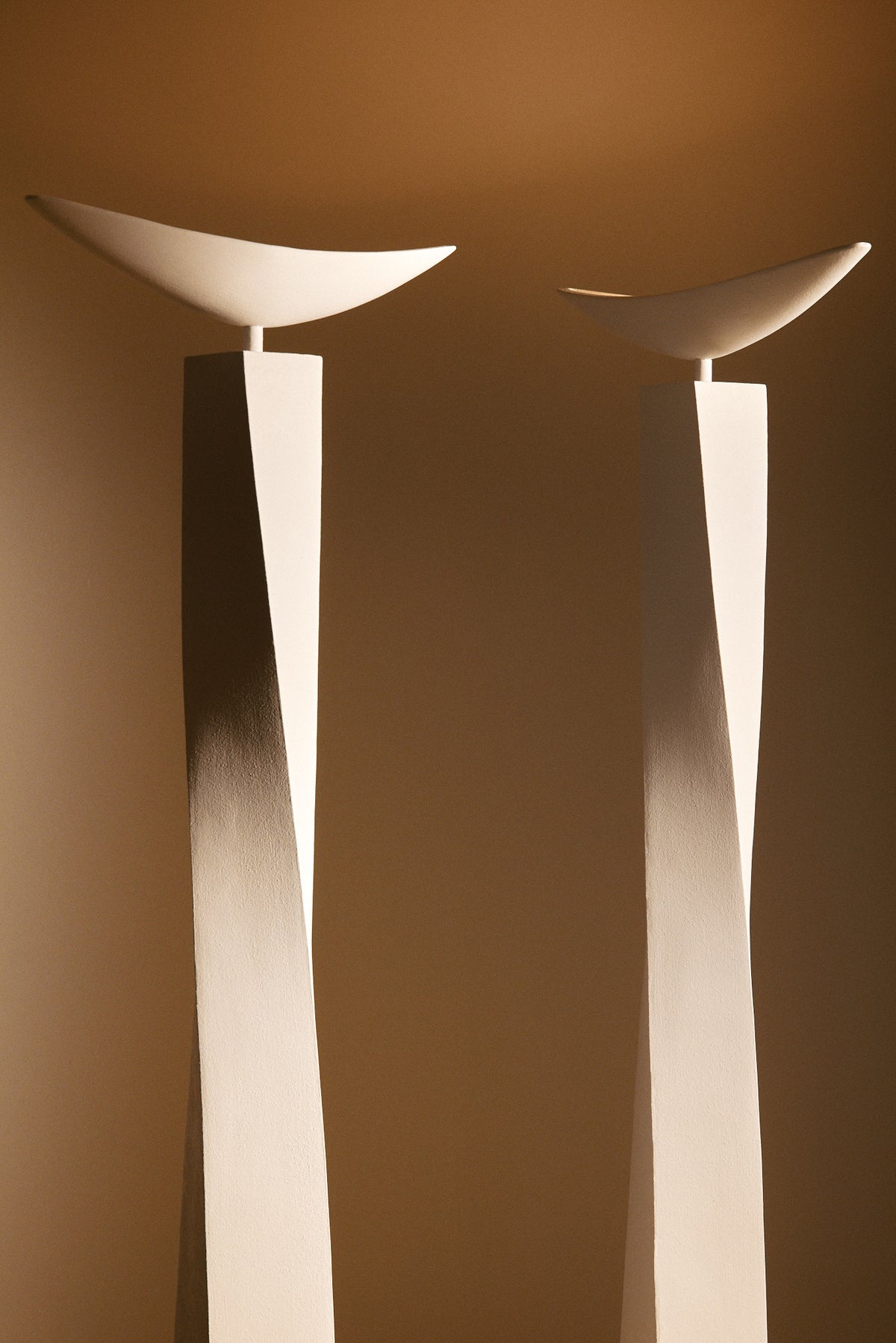 Alexander plaster floor lamp, closer view of two lamps from the dish to the column