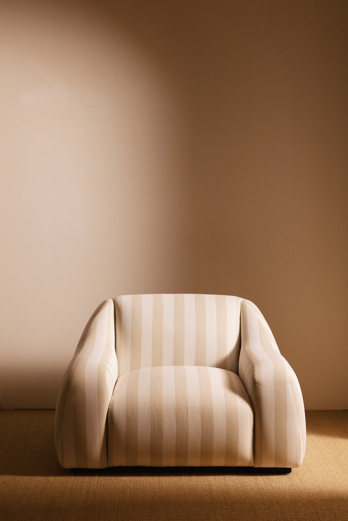 AS02 armchair in Jim Thomson Matelot Sea Shell fabric, front view of the seat and arms
