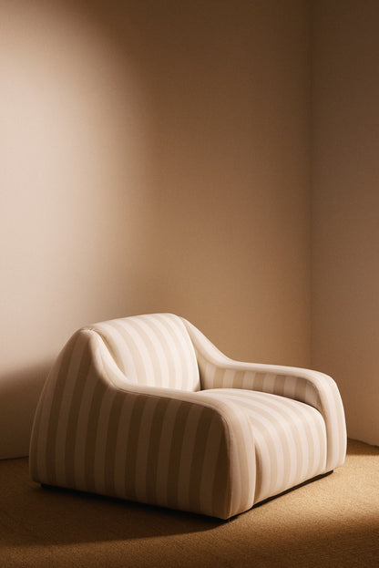 AS02 armchair in Jim Thomson Matelot Sea Shell fabric, three quarter view of the arms and back