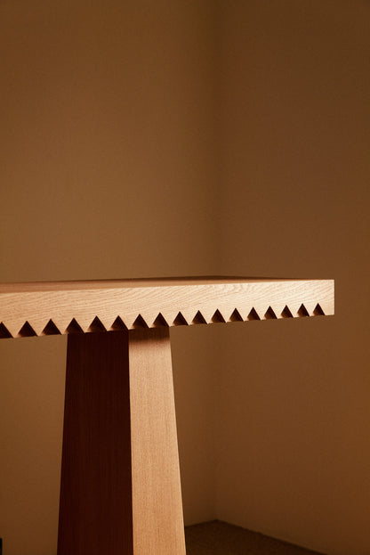 Baga oak console table, close view of the run of teeth along the edge