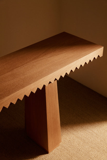 Baga oak console table, angled view of the toothed edge and top