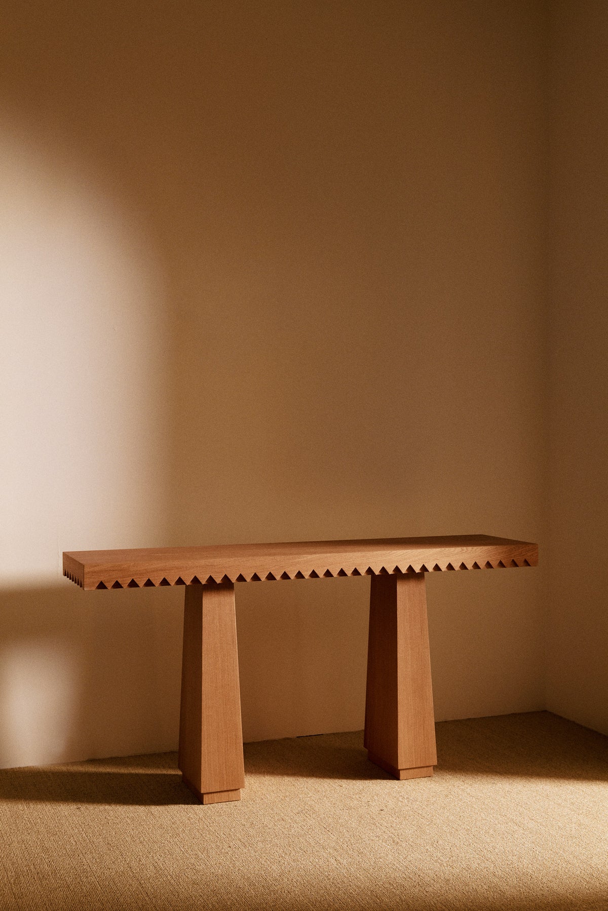Baga oak console table, wide front view against the wall